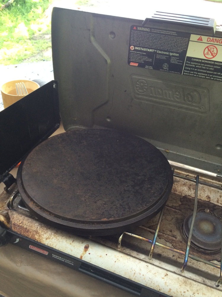 He brought the dutch oven for a dish he was making. I convinced him that the lid was meant to double as a griddle.